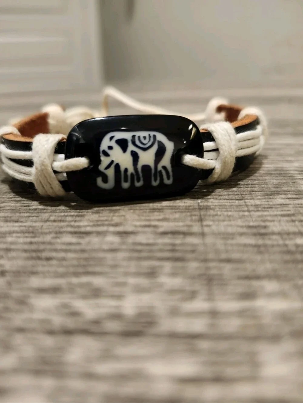 Brown And White Leather Bracelet W Black Elephant Bead And Adjustable Slide Bolo